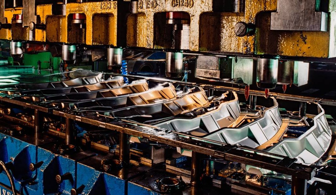 A close-up of a large industrial press used for a variety of sheet metal stamping applications.
