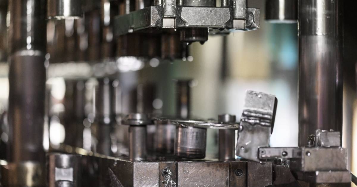 A hydraulic press stamping machine for forming custom sheet metal in an industrial manufacturing facility.
